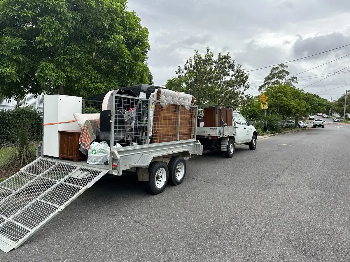 Rubbish Removal Brisbane ute and trailer loaded with household furniture for removal on the Gold Coast